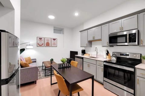 Kitchen: Modern kitchen with sleek stainless-steel appliances and ample counter space.