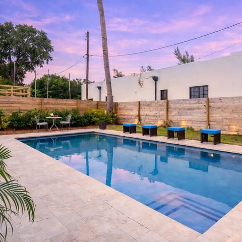 A serene backyard escape with a sleek private pool and soft sunset skies to end the day in style. 🌅💙