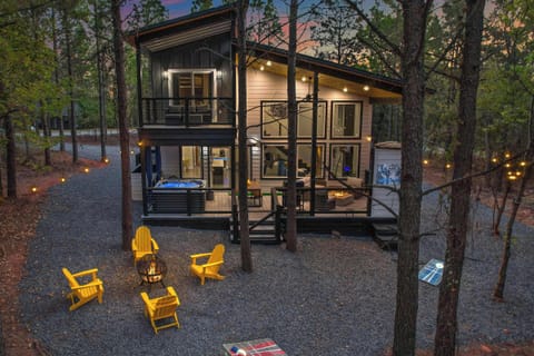 Welcome to Zoey's Haven! This 2BR + 2BA cabin includes an outdoor hot tub, BBQ grill, UNIQUE tree house and backyard playground, fire pit, arcade games & more!