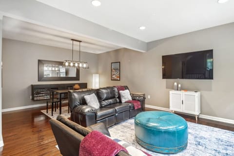Spacious living room with comfortable seating and TV
