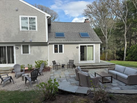Backyard Patio - 8 person dinning table, 6 person sofa and 6 person fire pit