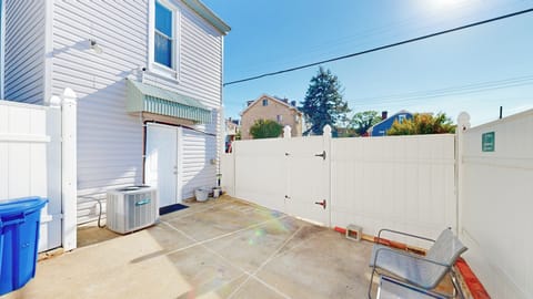 Outdoor patio with outdoor furniture, grill, firepit, chairs, & privacy fence!
