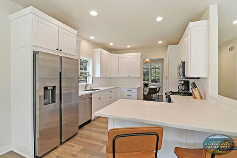 Fully-equipped kitchen with breakfast bar seating