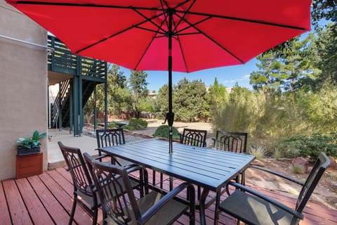Outdoor space includes a dining area with seating for six