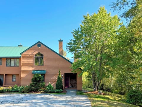 Spacious 5-bedroom end unit Mount Washington Place condo is just across the main road from the Bretton Woods Ski Area! Mountains in the background for partial views.