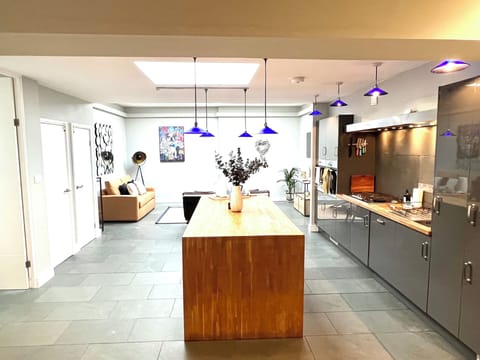 Kitchen: Sleek design meets vibrant blue lights—your culinary creativity awaits!