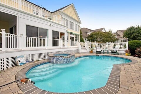 3133 May Drive, Bethany Lakes - private pool - The stunning private backyard oasis, featuring a custom in-ground pool and integrated heated spa.