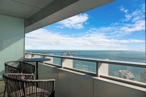 Balcony with bistro table overlooking Biscayne Bay & Atlantic Ocean, accessible off the living room and Bedroom 1
