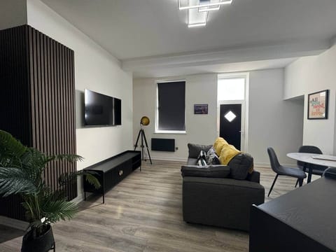 Living Room with Smart TV, Dining table & Chairs, double sofa bed 