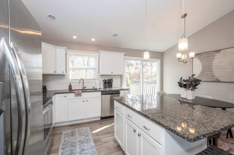 The open, airy kitchen offers loads of space & all the comforts of home