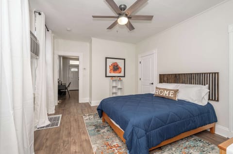 A plush queen-sized bed awaits in the serene bedroom retreat