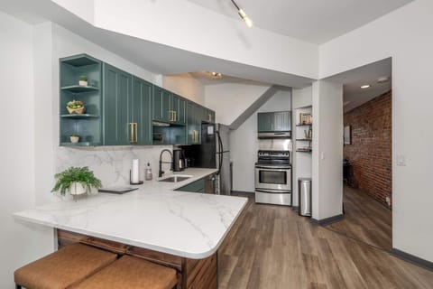 The elegant kitchen offers ample space & all the comforts of home