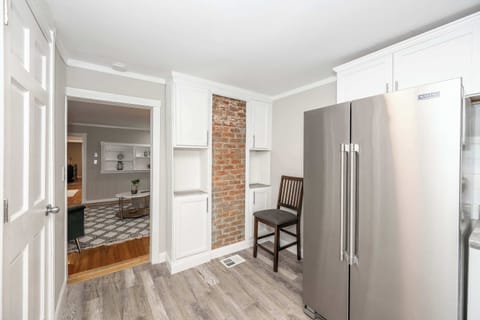 The bright, cozy kitchen offers ample space & all the comforts of home