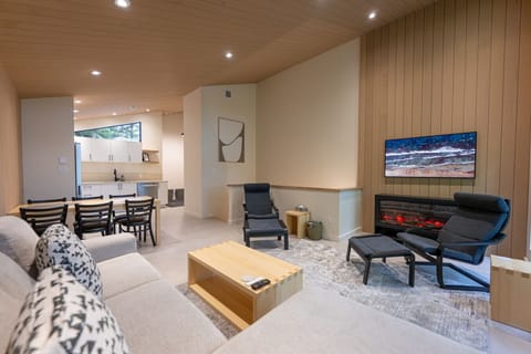 Cozy living room with fire pace and TV