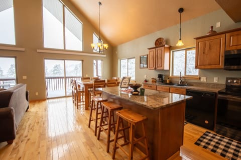 There’s ample seating around both the dining table and the kitchen island, making it easy for everyone to gather for meals and conversation.