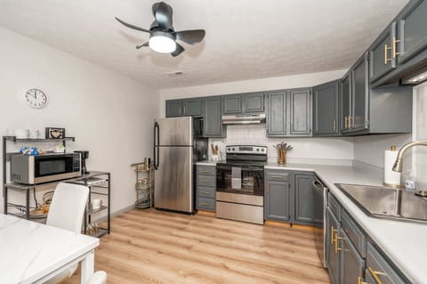 The elegant kitchen offers ample space & all the comforts of home