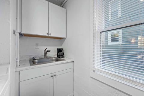 The cozy kitchen offers ample storage space & every home comfort