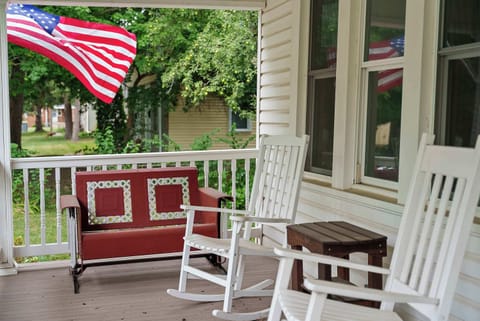 Sip morning coffee or an evening cocktail on the serene front porch