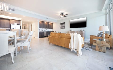 Relax on the cozy sofa with a queen sleeper in this inviting family room with breathtaking beachfront views