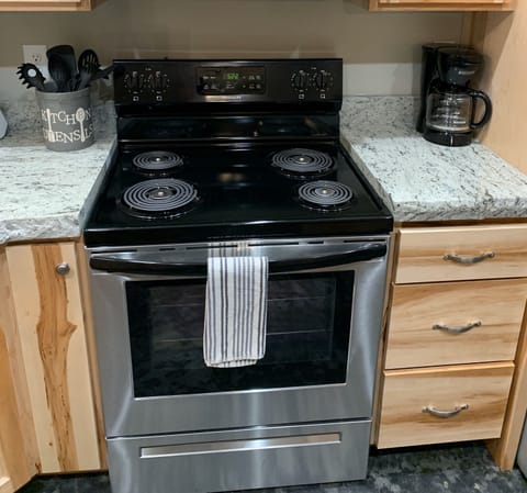 Large kitchen fully equipped with everything needed for home-cooked meals.