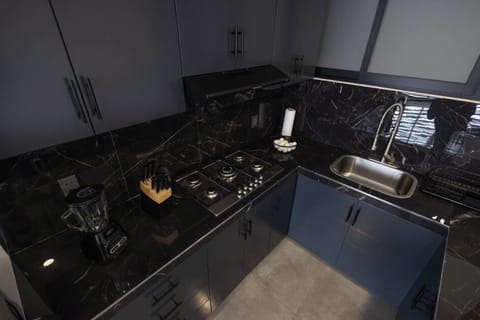 Deluxe Studio, 2 Bedrooms | Private kitchen | Cookware/dishes/utensils, dining tables