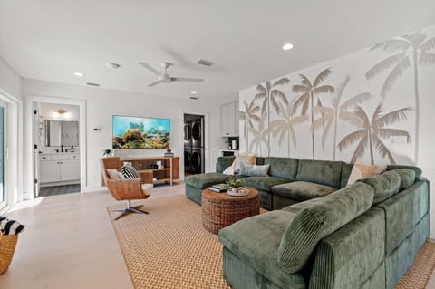 1st floor living room with full bathroom, laundry room, beverage area and sliding door to the back (3)