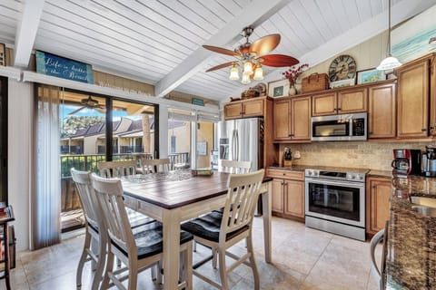 Inside, enjoy inviting living and dining areas, a fully equipped kitchen, and morning coffee or evening cocktails on the deck with direct pool and beach access right off your door.