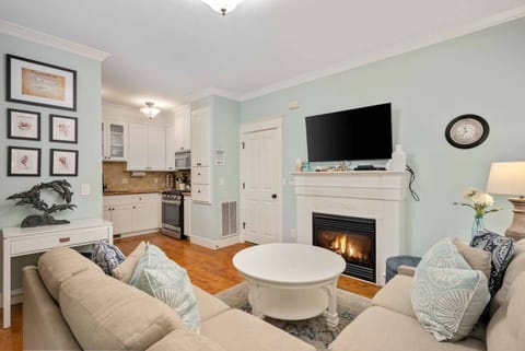 The cozy living room offers a big screen TV and gas fireplace for those chilly nights.