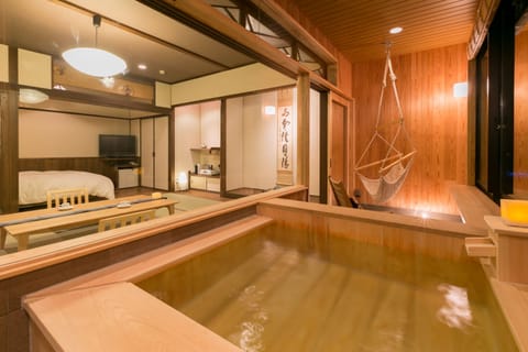 Double Room with Tatami Area and Hot Spring Bath - Ran  | Bathroom | Free toiletries, hair dryer, electronic bidet, towels
