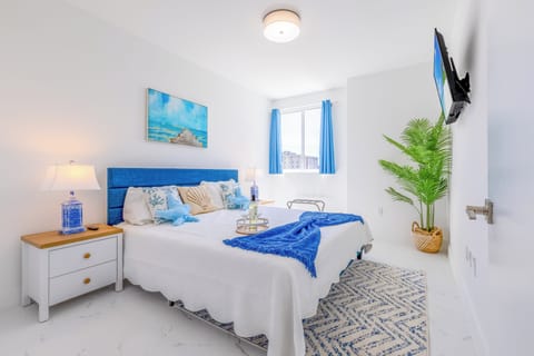 Relax in our modern bedroom featuring a king-sized bed and ample storage space. 