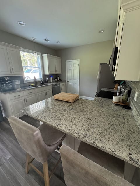 Full Kitchen with bar height seating. 