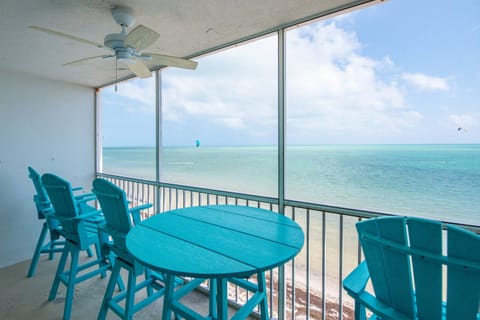 Savor your morning coffee or unwind with an afternoon cocktail on the screened porch, where breathtaking views stretch endlessly before you.