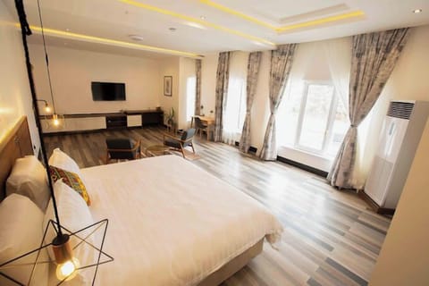 Deluxe Room, Balcony, City View | Desk, laptop workspace, free WiFi