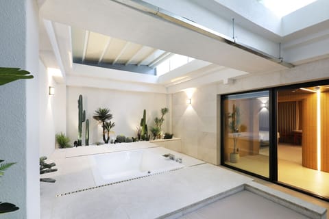 Luxury Suite, Non Smoking | Bathroom | Combined shower/tub, hair dryer, slippers, bidet