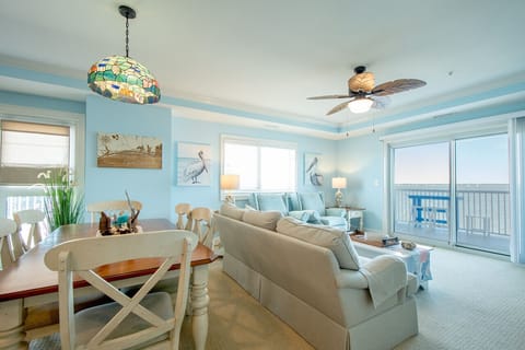 Coastal living room with sound views and private balcony access