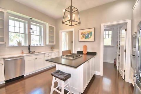 Large kitchen with seating for 2. Walk-in pantry/ laundry room, dishwasher, oven