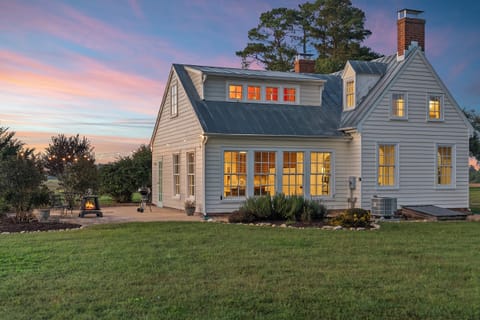 Charming Cottage Exterior: Enjoy sunsets and starry nights from your outdoor retreat!