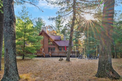 A view of the back of the home and its one of two fire pit areas