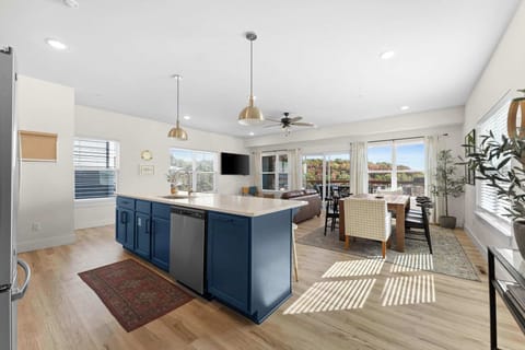 The kitchen and dining area flow into the main living room; creating an open-concept layout that's perfect for a large group to be able to gather in one place!