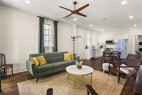 Open-concept living space with modern kitchen, dining table, and cozy seating—perfect for cooking, dining, and relaxing together.