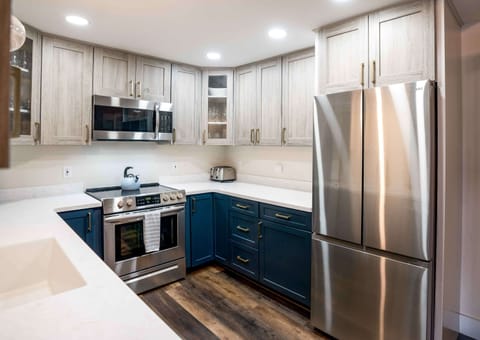 The chic, updated kitchen offers ample space & all the comforts of home