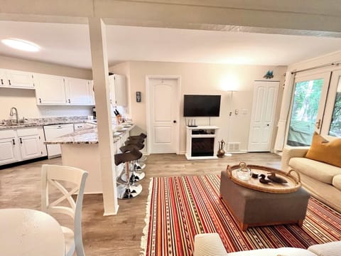 Cozy and spacious living area with TV