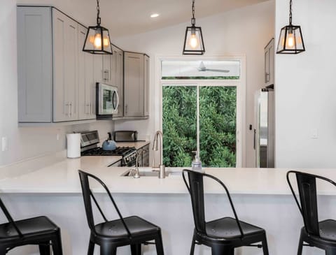 Sip morning coffee or grab a bite at the kitchen counter, with seating for 4