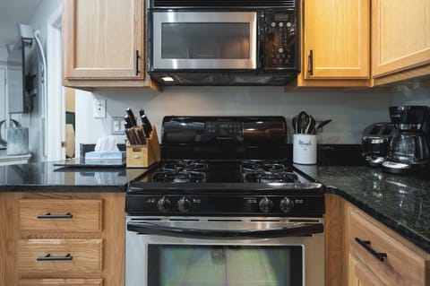 The kitchen offers ample storage space & all the comforts of home