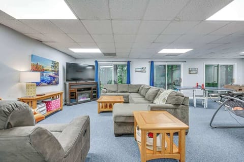 Play and relax in the basement game room with TV, ping-pong, and air hockey.