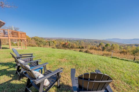 Relax and unwind in this idyllic outdoor setting at Valley View Getaway. Two comfortable Adirondack chairs face the breathtaking views of the lush Ellett Valley, inviting you to enjoy your morning coffee or an evening drink while soaking in the natural beauty. The perfect spot to catch up with loved ones or simply bask in the serene surroundings. This peaceful retreat is your g...