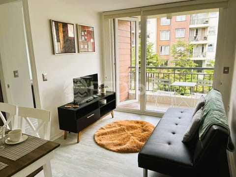 Comfort Apartment | Living area | 32-inch flat-screen TV with digital channels