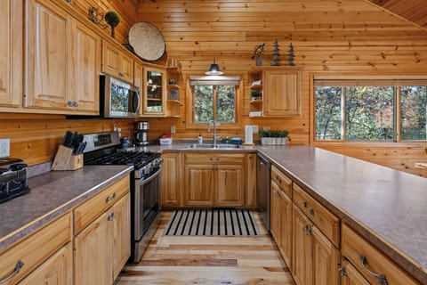 Fully equipped kitchen with ample space for the entire family to gather.