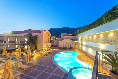 Seasonal outdoor pool, open 8:00 AM to 8:00 PM, pool umbrellas
