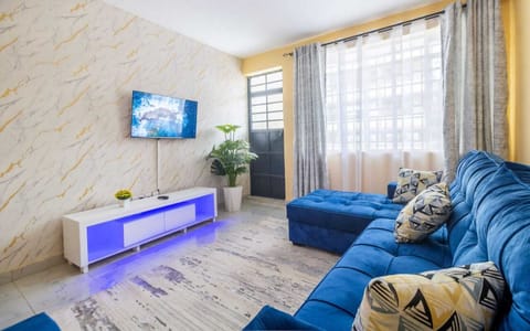 Deluxe Apartment, City View | Living area | 24-inch Smart TV with digital channels